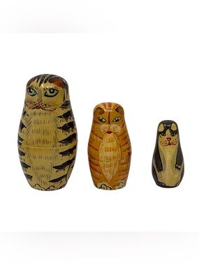 Vintage hand painted nesting cats made of wood largest cat is 3 inches tall